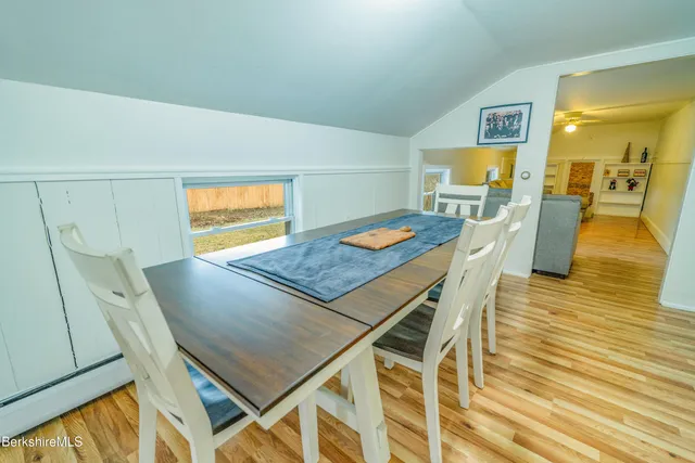 a bed room with two bed and a night stand