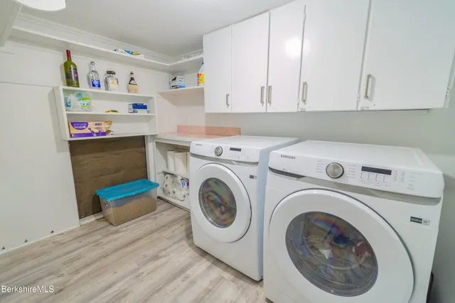 a bathroom with a sink a toilet and shower curtain