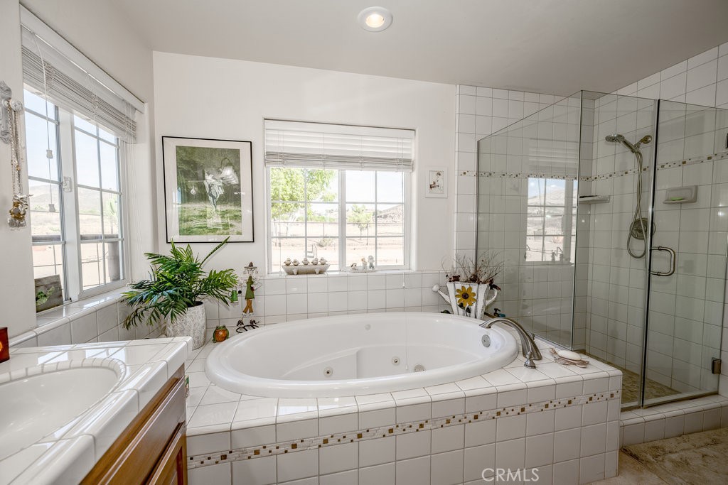 34554 Koontz Road Agua Dulce, CA 91390 - Photo 13 of 33 a white bath tub sitting in a bathroom next to a window