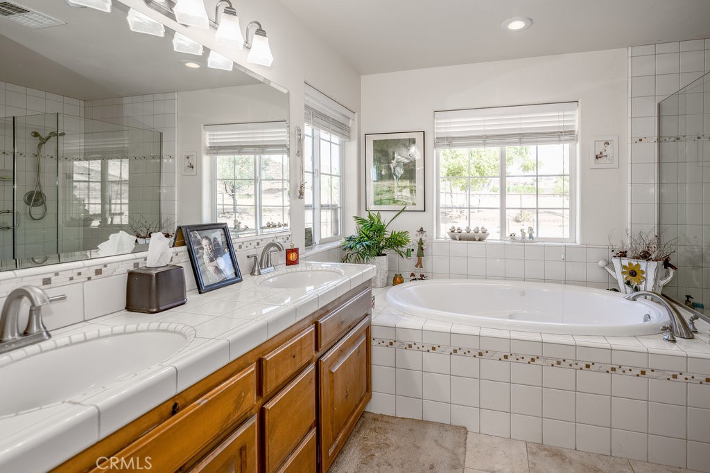 34554 Koontz Road Agua Dulce, CA 91390 - Photo 14 of 33 a bathroom with a granite countertop sink mirror and a bathtub