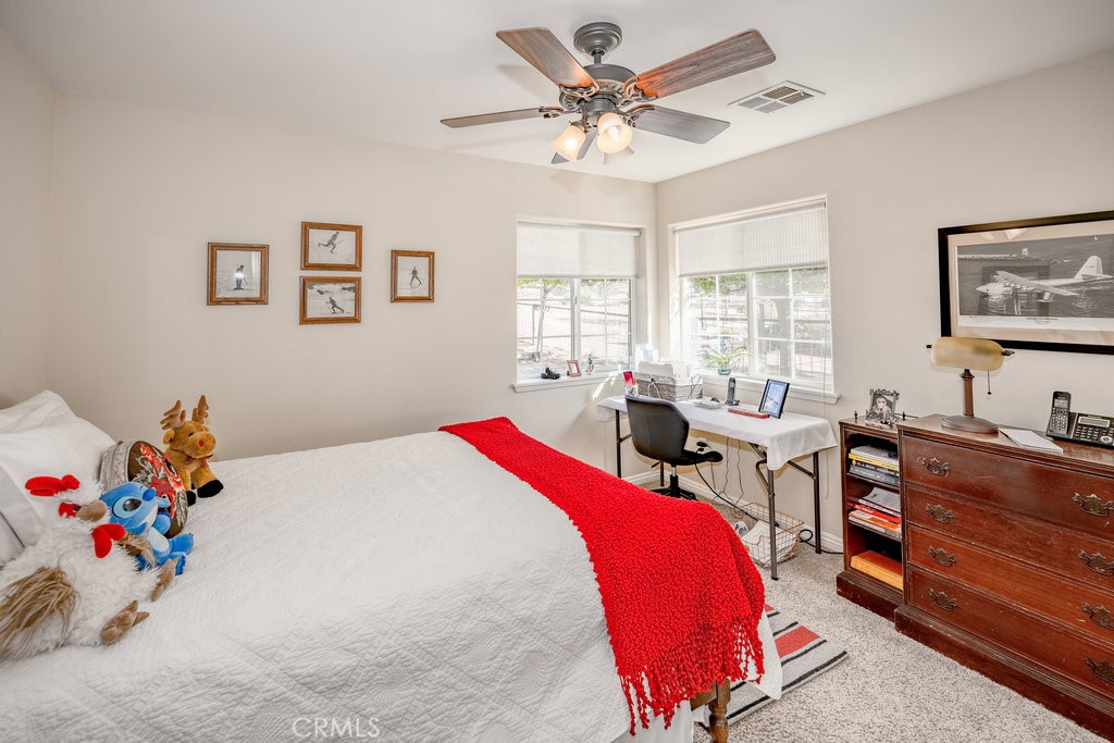 34554 Koontz Road Agua Dulce, CA 91390 - Photo 18 of 33 a bed room with a bed and a couch