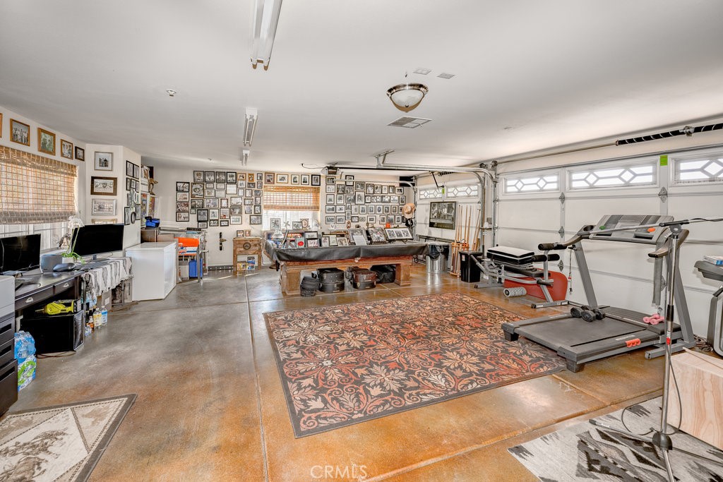 34554 Koontz Road Agua Dulce, CA 91390 - Photo 26 of 33 a living room with lots of furniture and kitchen view