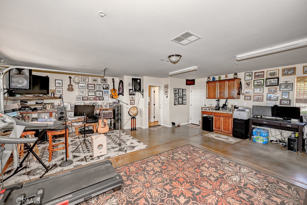 34554 Koontz Road Agua Dulce, CA 91390 - Photo 27 of 33 a living room with lots of furniture and kitchen view