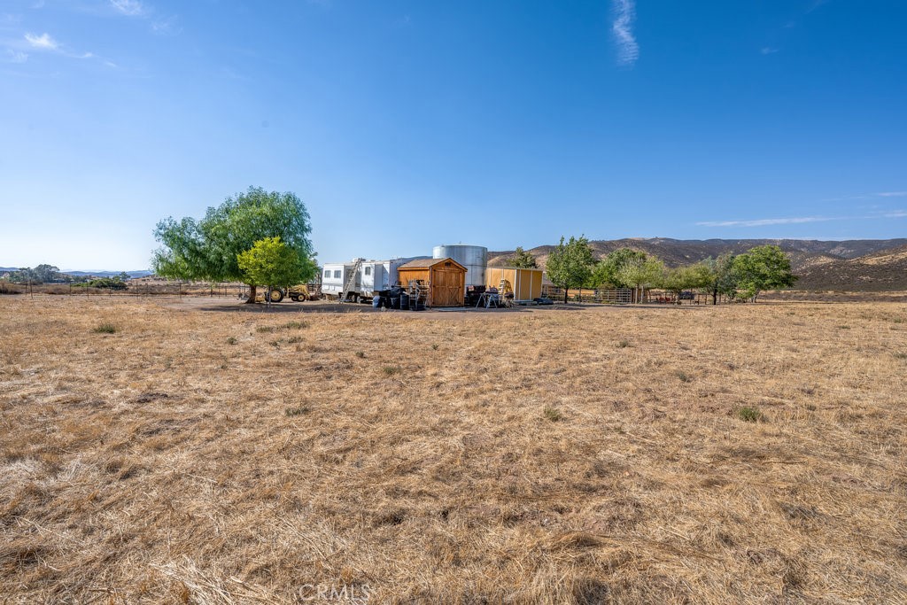 34554 Koontz Road Agua Dulce, CA 91390 - Photo 33 of 33 a view of a yard with a bench