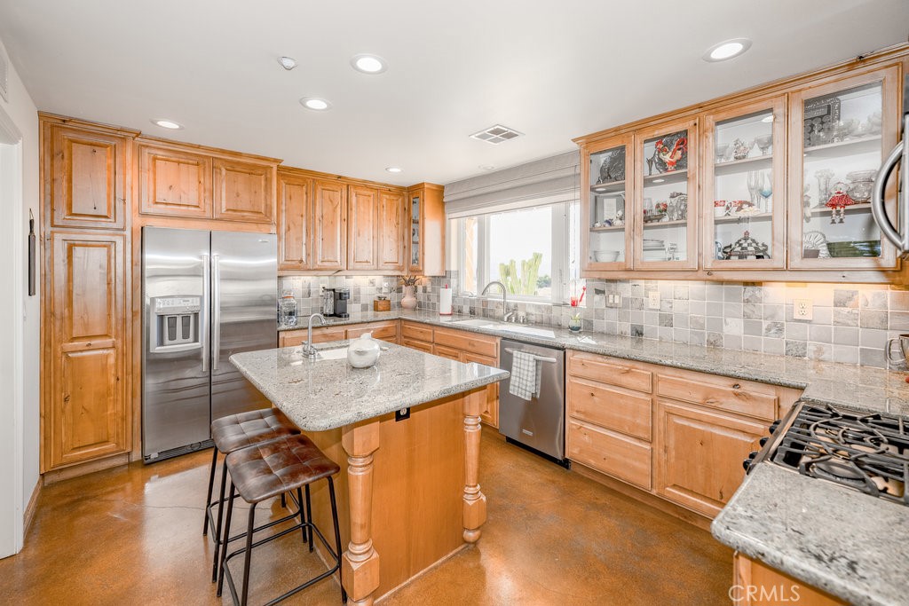 34554 Koontz Road Agua Dulce, CA 91390 - Photo 5 of 33 a kitchen with stainless steel appliances granite countertop a refrigerator a sink a stove and island