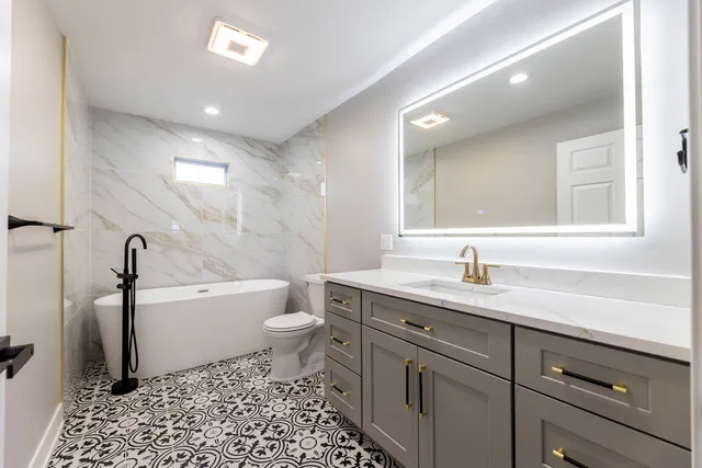 a bathroom with a sink a toilet and a bathtub