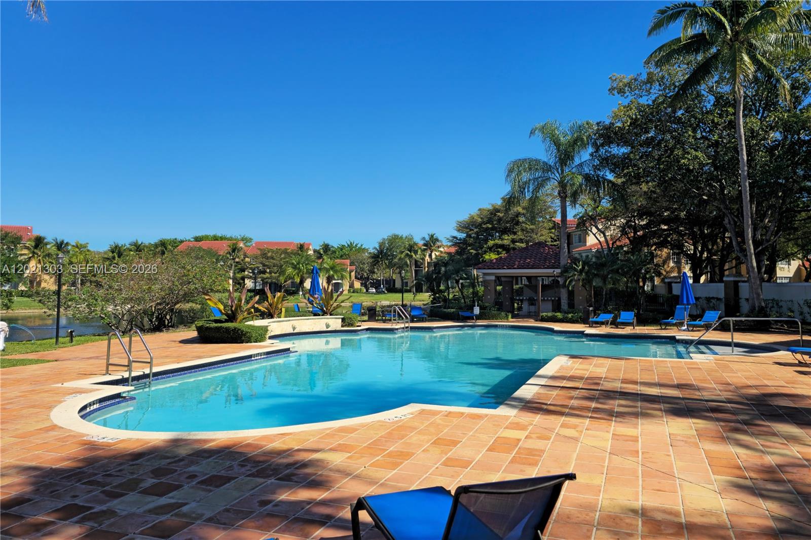 2123 Renaissance Boulevard, Unit 201 Miramar, FL 33025 - Photo 4 of 22 a view of a swimming pool with a yard