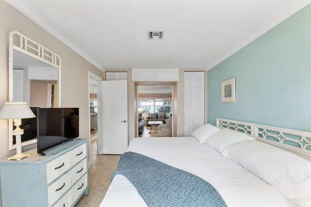 a hallway with furniture and a large window