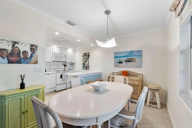 a living room with furniture a window and a chandelier