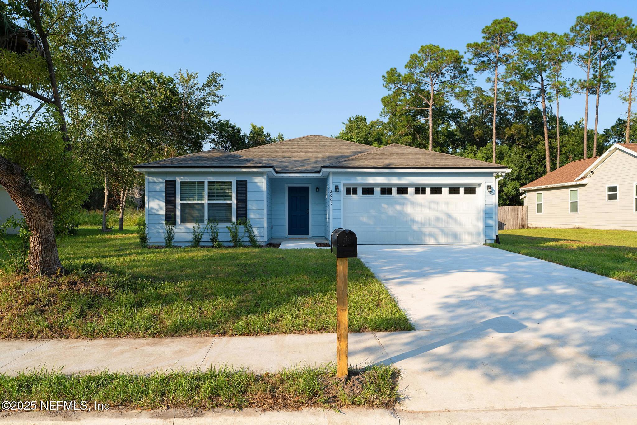 2005 Benedict Road Jacksonville, FL 32209 - Photo 1 of 24 a front view of a house with a yard