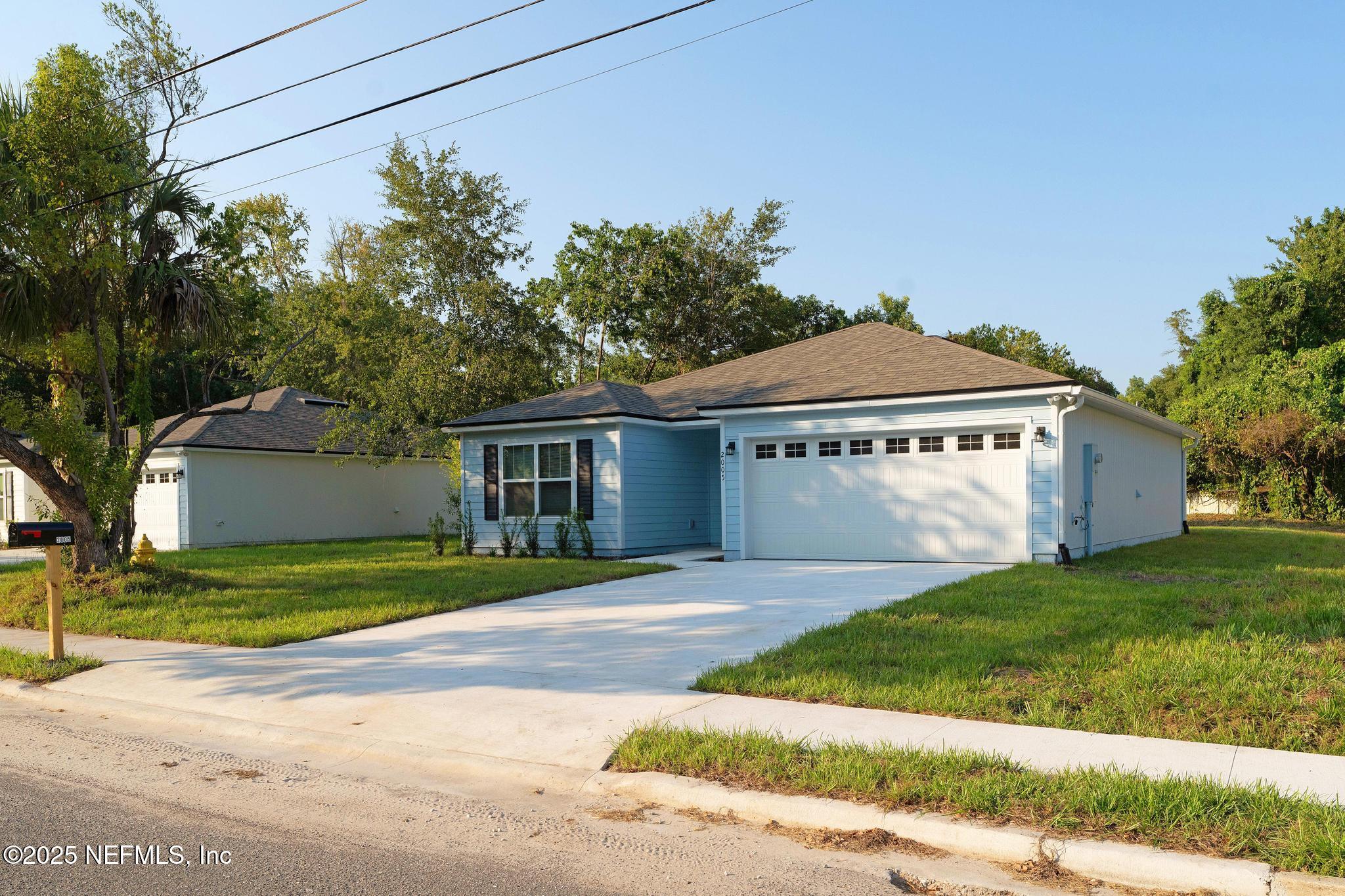 2005 Benedict Road Jacksonville, FL 32209 - Photo 24 of 24 a front view of a house with a yard and garage