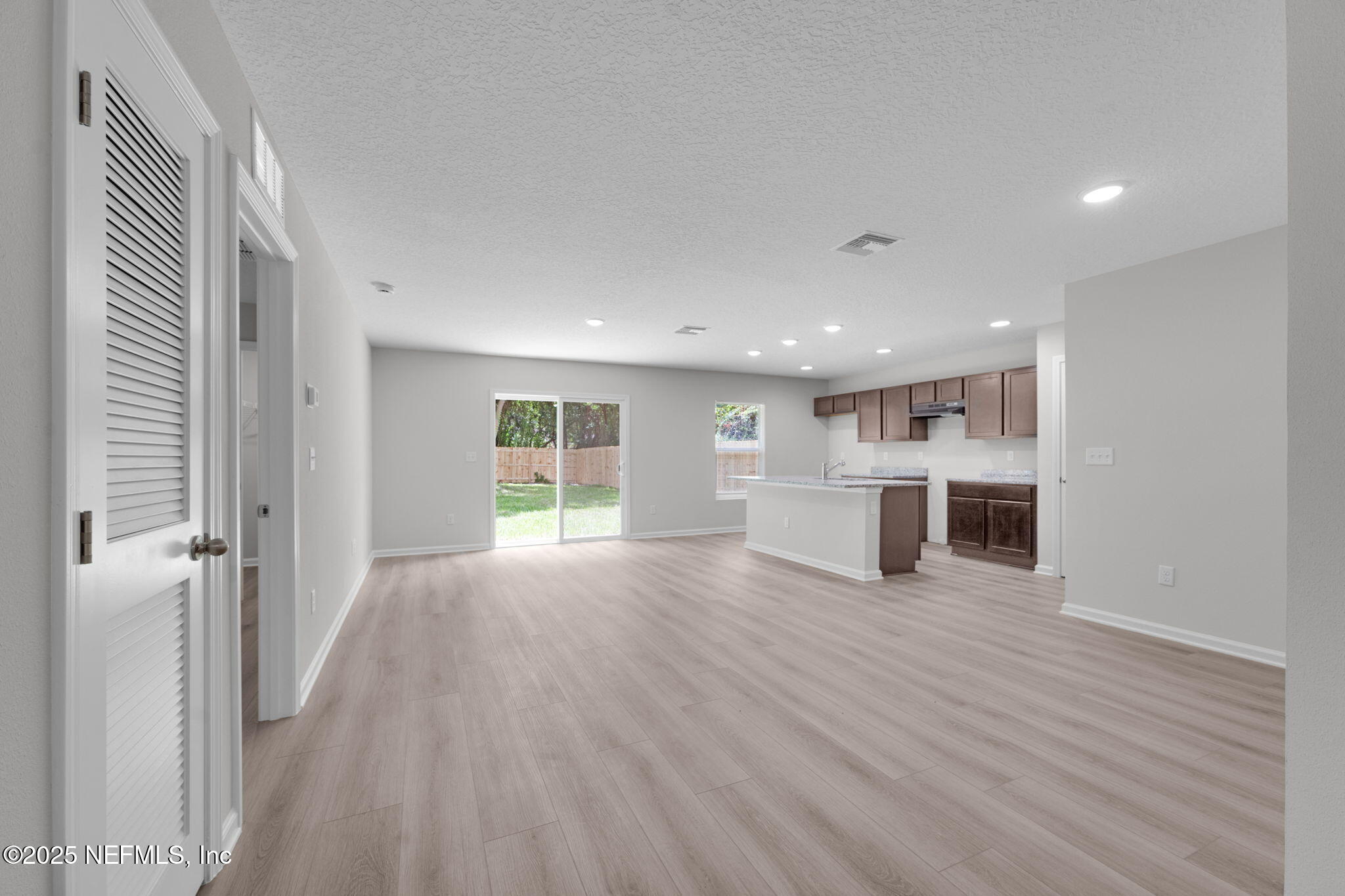2005 Benedict Road Jacksonville, FL 32209 - Photo 10 of 24 a view of a kitchen with wooden floor and windows