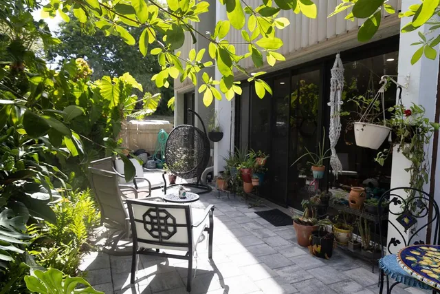 a living room filled with furniture and flowers