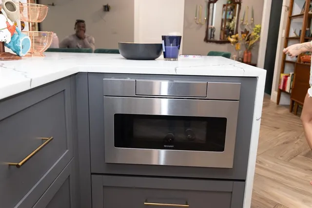 a view of a utility room with wooden floor washer and dryer