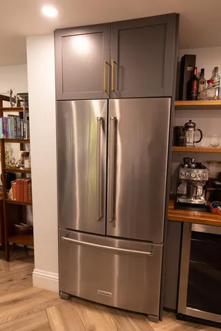 a close view of a stove a microwave and cabinets