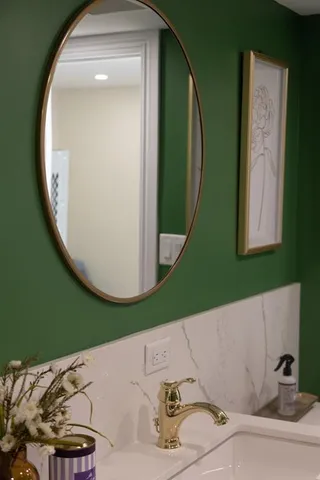 a view of walk in closet with wooden floor
