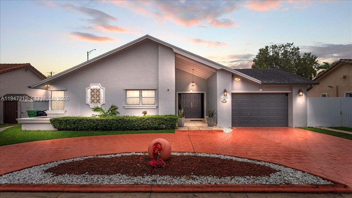 a front view of a house with garden