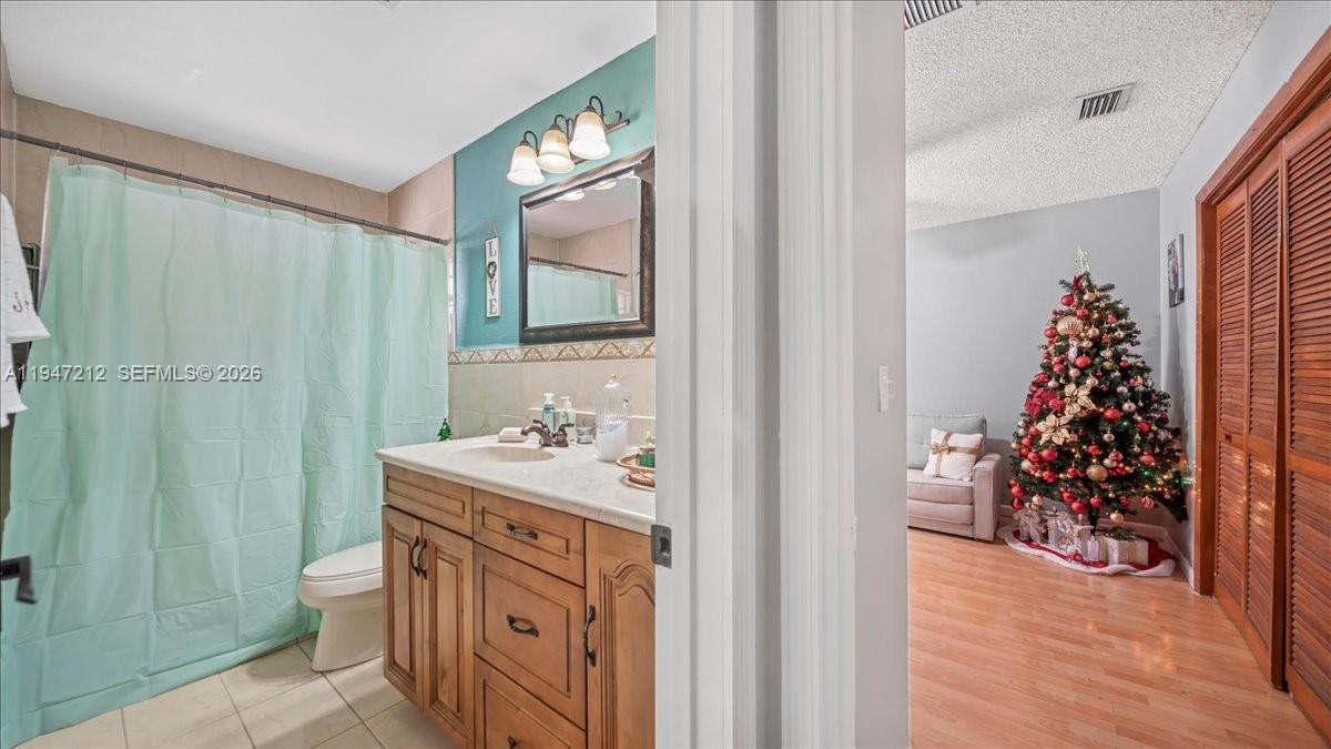 13430 Southwest 25th Street Miami, FL 33175 - Photo 16 of 49 a bathroom with a sink toilet and shower