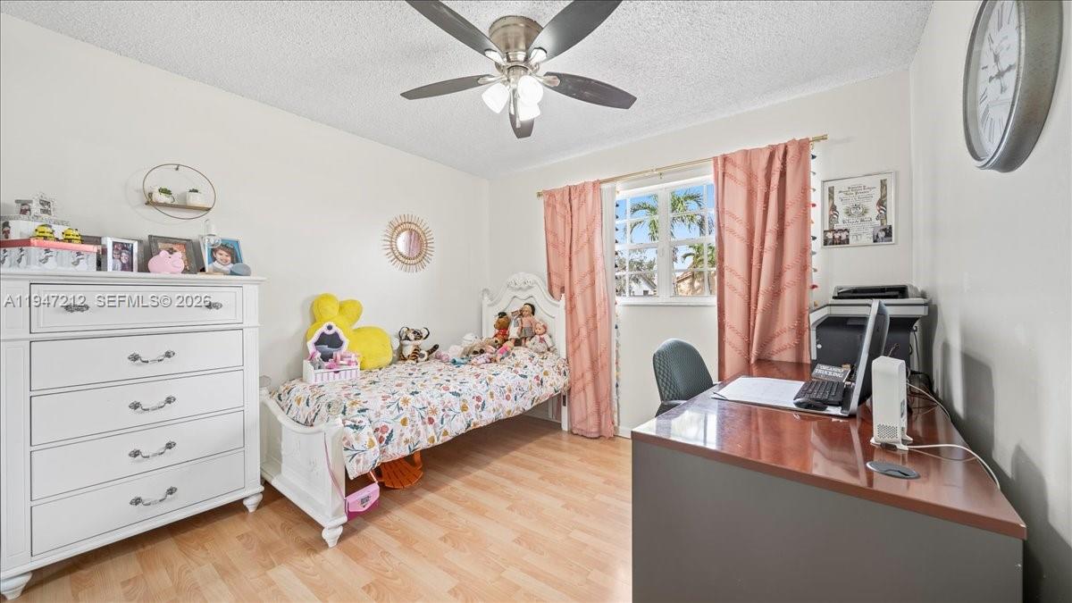 13430 Southwest 25th Street Miami, FL 33175 - Photo 19 of 49 a bedroom with a bed and a dresser