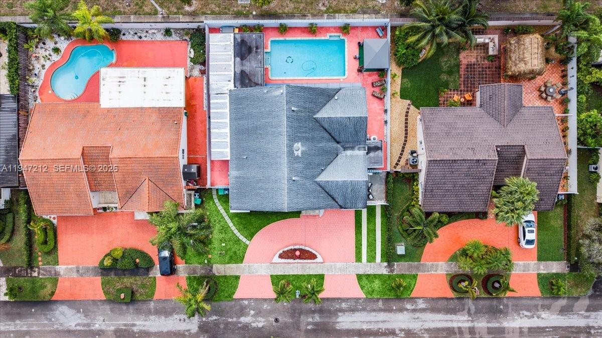 13430 Southwest 25th Street Miami, FL 33175 - Photo 43 of 49 an aerial view of multiple houses with a yard