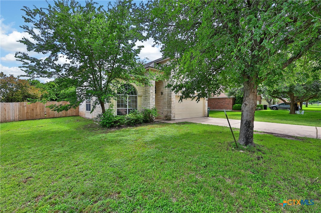 7015 Rickey Drive Temple, TX 76502 - Photo 3 of 29 a view of a house with backyard and a tree