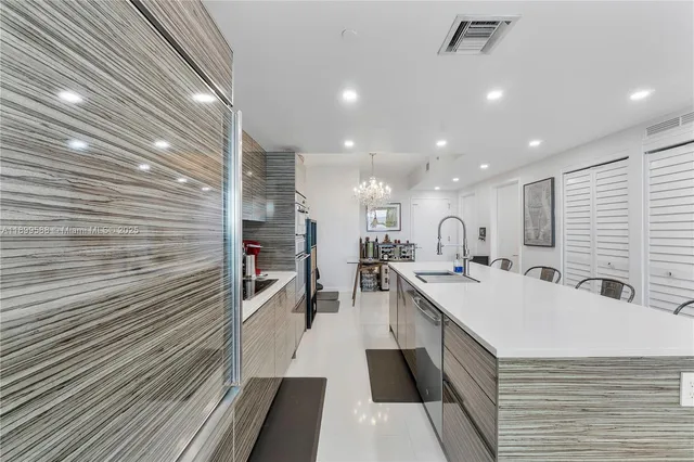 a large white kitchen with a large window
