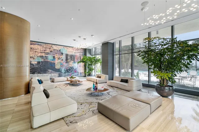 a view of a swimming pool with outdoor seating and a patio