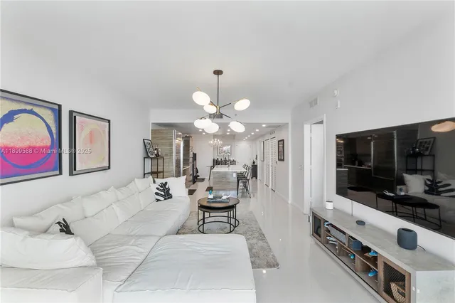 a living room with furniture and flat screen tv