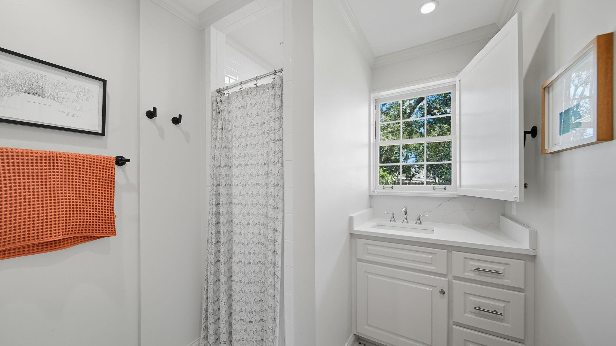 678 Moss Road Memphis, TN 38117 - Photo 10 of 33 Bathroom featuring a stall shower, ornamental molding, and vanity