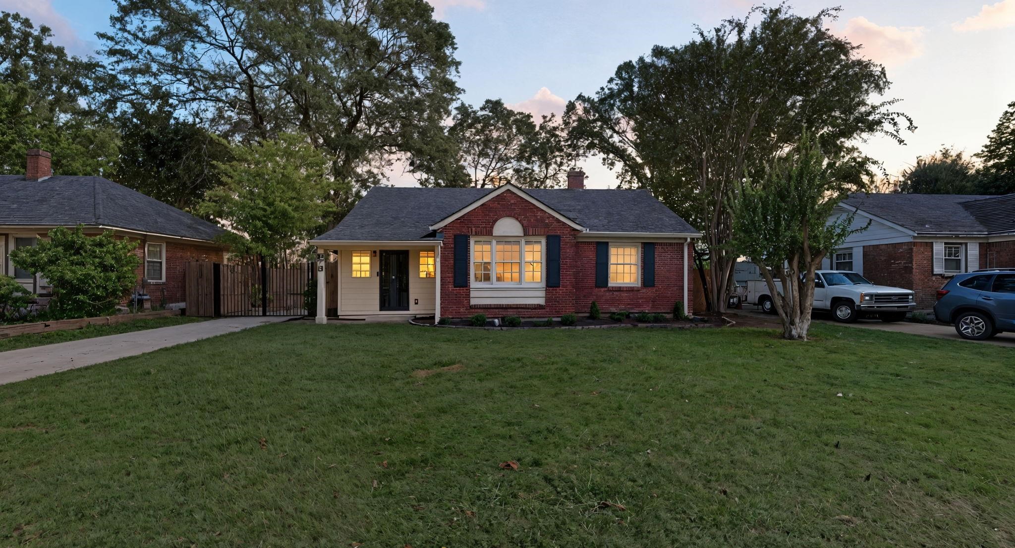 678 Moss Road Memphis, TN 38117 - Photo 2 of 33 Ranch-style home featuring a yard, brick siding, a chimney, and driveway