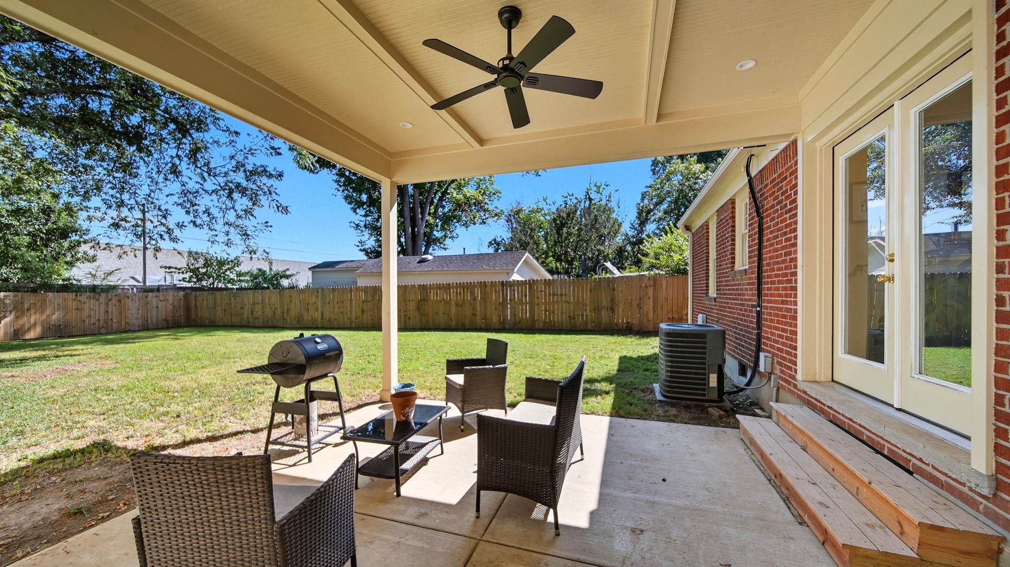 678 Moss Road Memphis, TN 38117 - Photo 31 of 33 Fenced backyard featuring a patio area, ceiling fan, and grilling area
