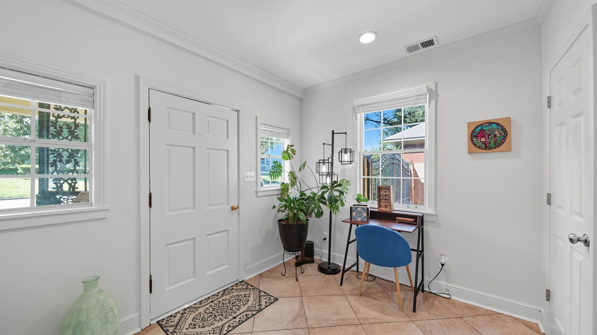 678 Moss Road Memphis, TN 38117 - Photo 4 of 33 Entryway featuring light tile patterned floors, ornamental molding, and recessed lighting