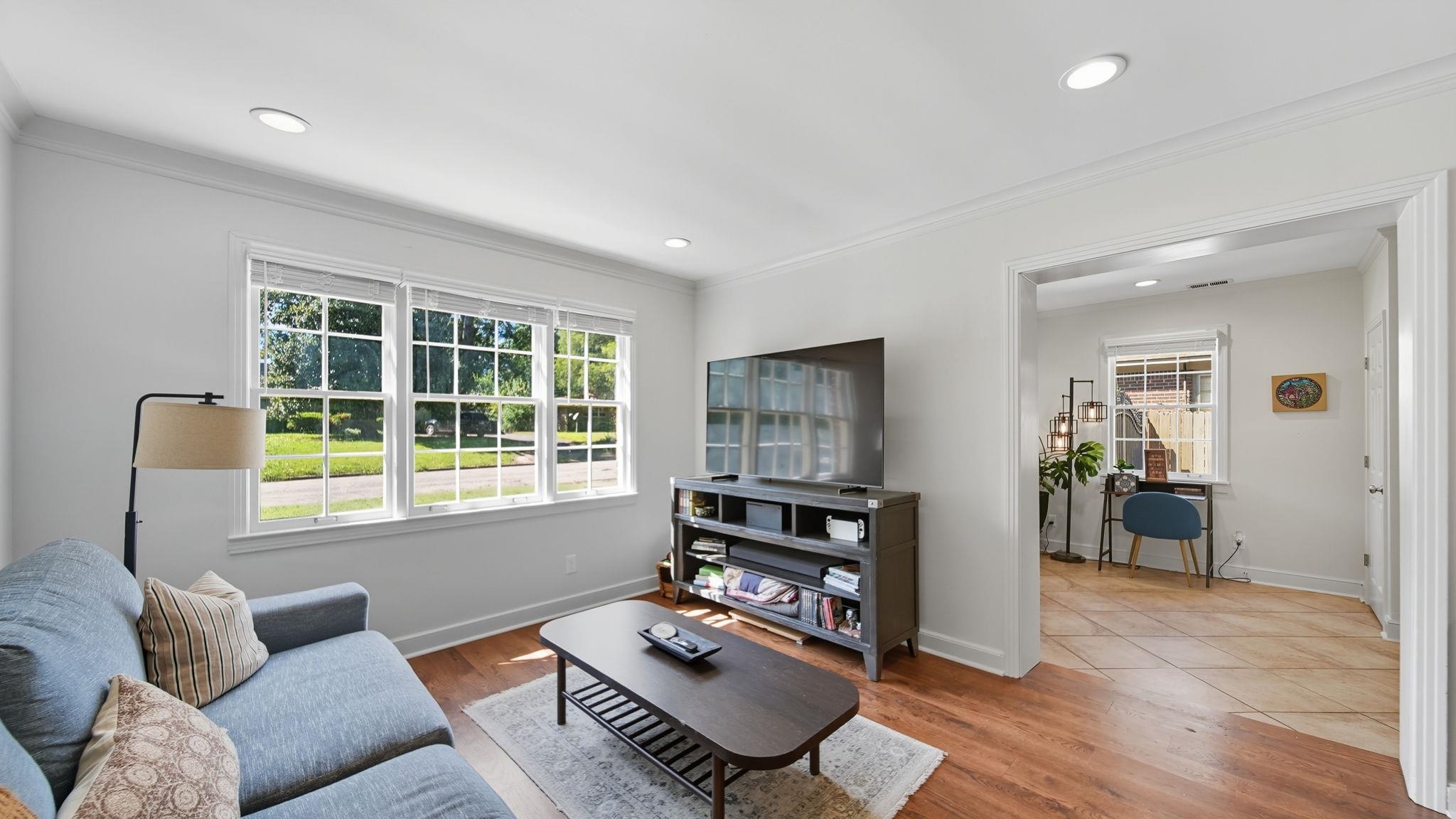 678 Moss Road Memphis, TN 38117 - Photo 5 of 33 Living area with ornamental molding, wood finished floors, and recessed lighting