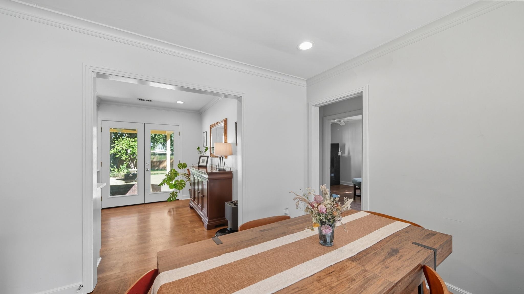678 Moss Road Memphis, TN 38117 - Photo 6 of 33 Dining area with ornamental molding, recessed lighting, wood finished floors, and french doors