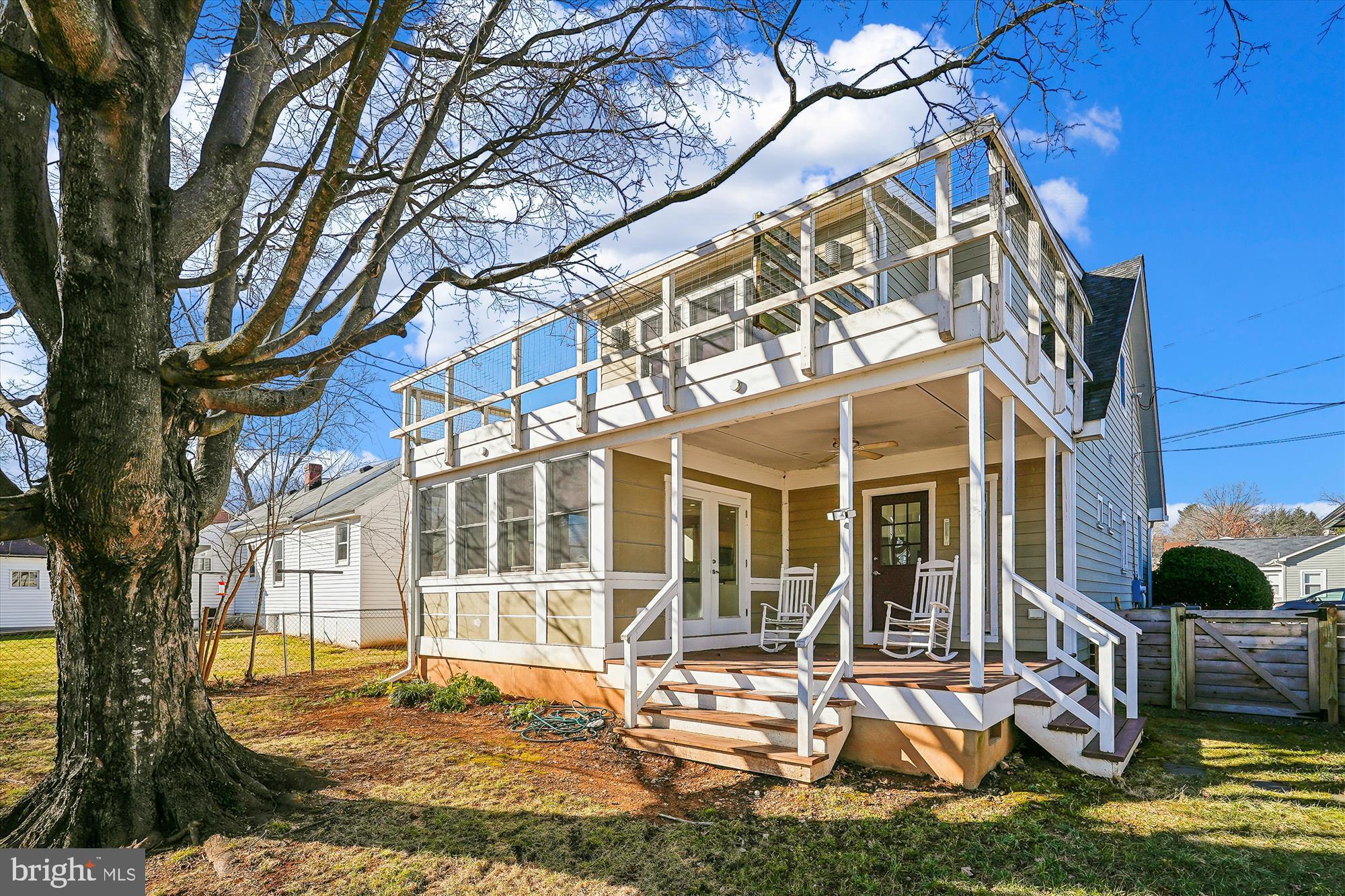 a view of a house with backyard porch and sitting area