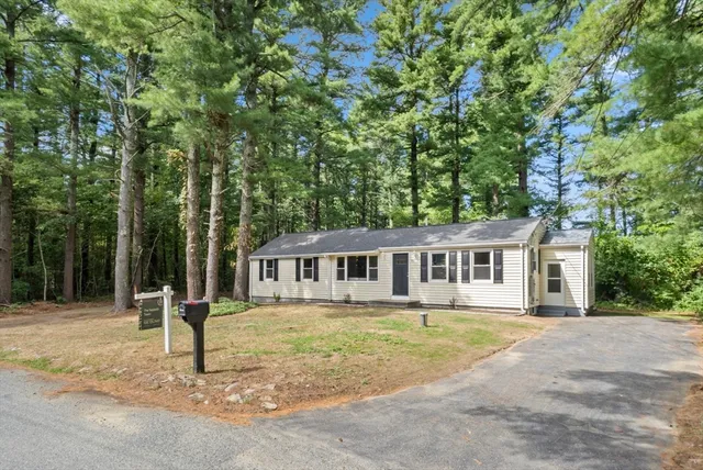 a house with trees in the background