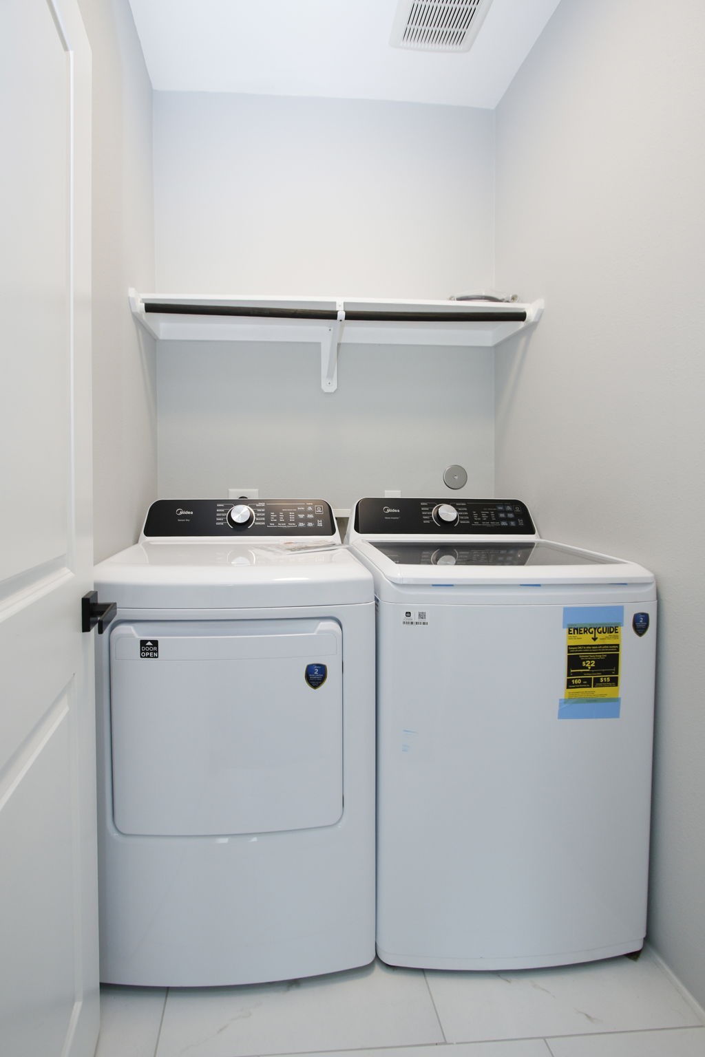 4337 Faulkner Street Houston, TX 77021 - Photo 31 of 39 a utility room with dryer washer and empty racks
