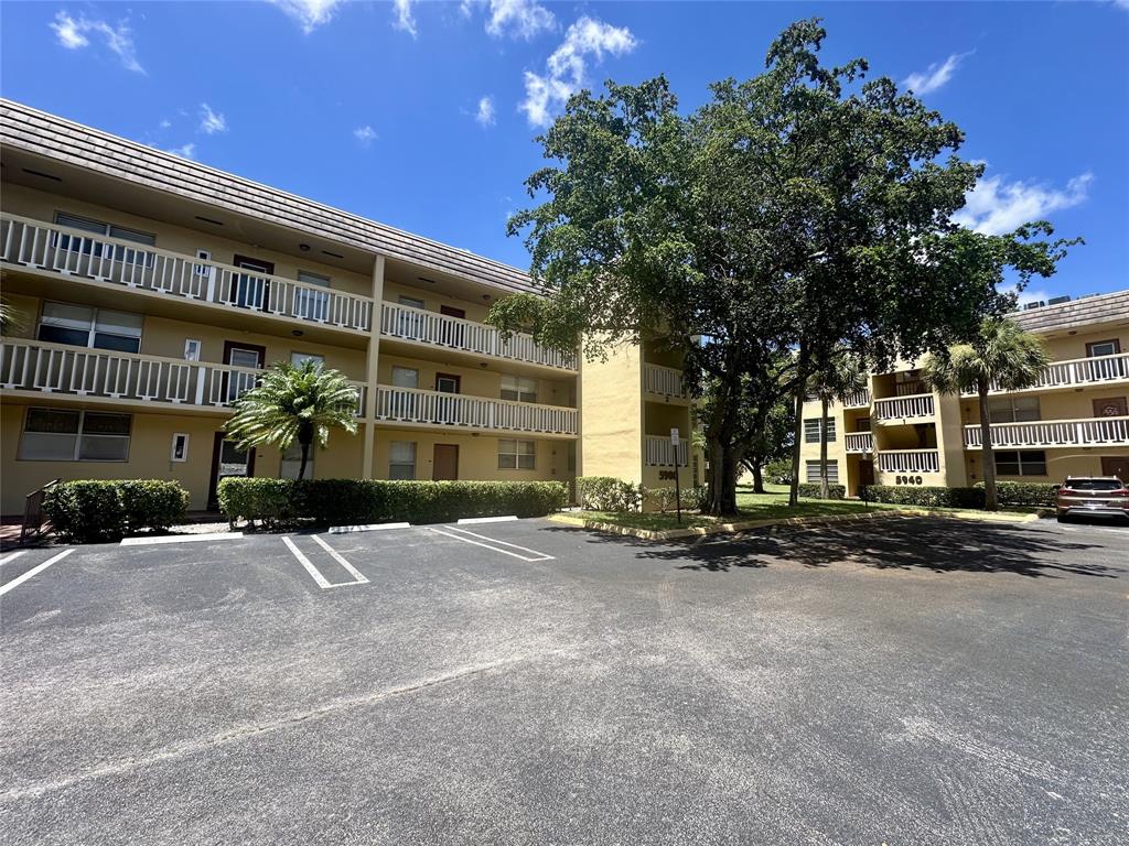 a front view of a building with street view