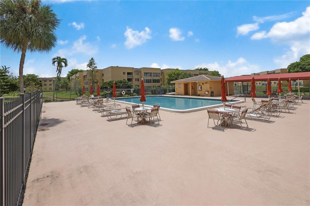 5980 Northwest 64th Avenue, Unit 112 Tamarac, FL 33319 - Photo 13 of 13 a view of a lake with outdoor space
