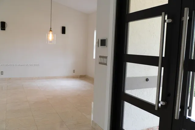 a view of an empty room with a window