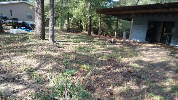 a view of a house with backyard
