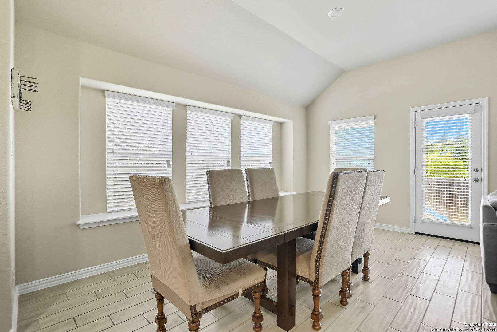 9825 Jon Boat Way Boerne, TX 78006 - Photo 12 of 24 a view of a dining room with furniture and wooden floor