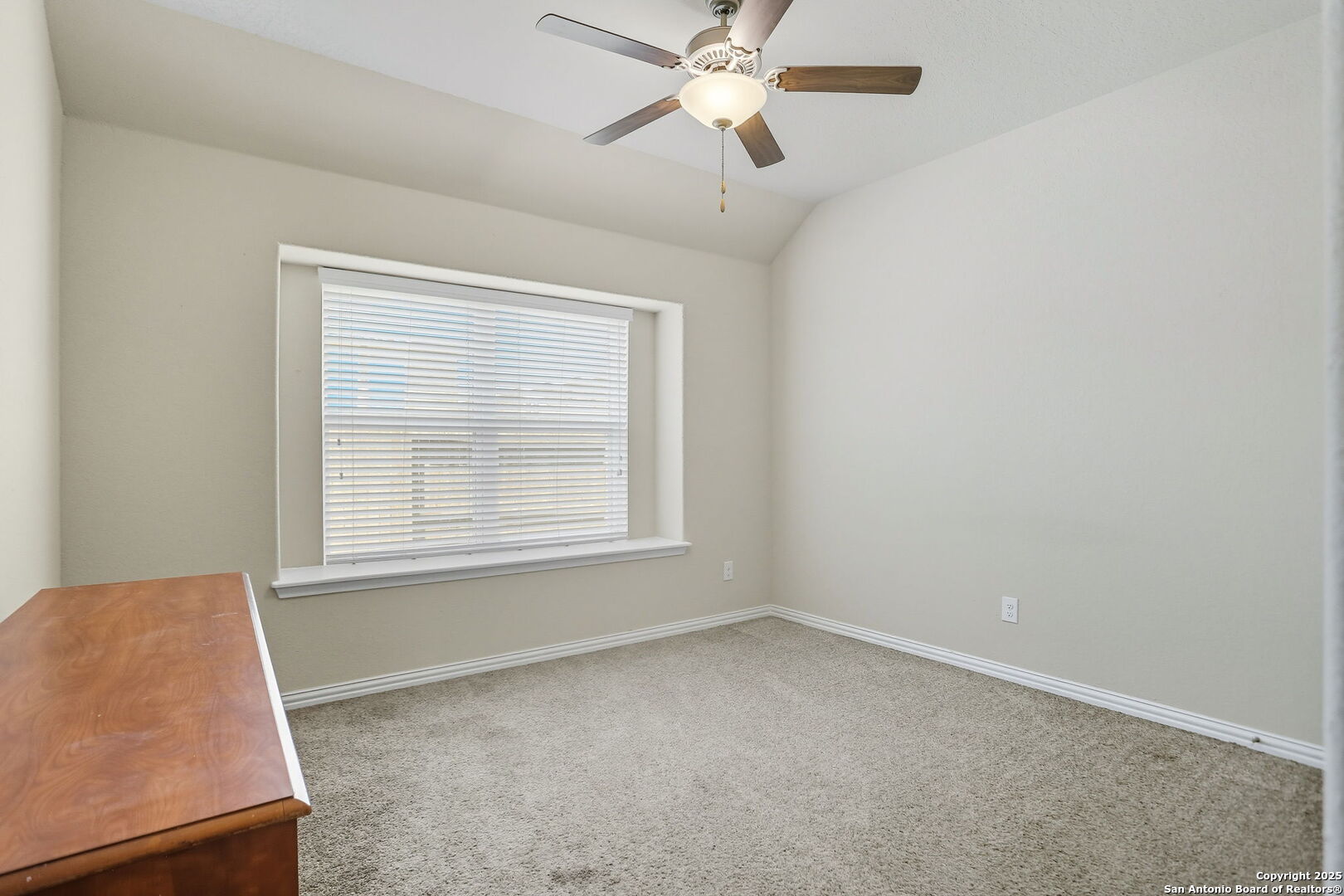9825 Jon Boat Way Boerne, TX 78006 - Photo 20 of 24 an empty room with a window and a fan