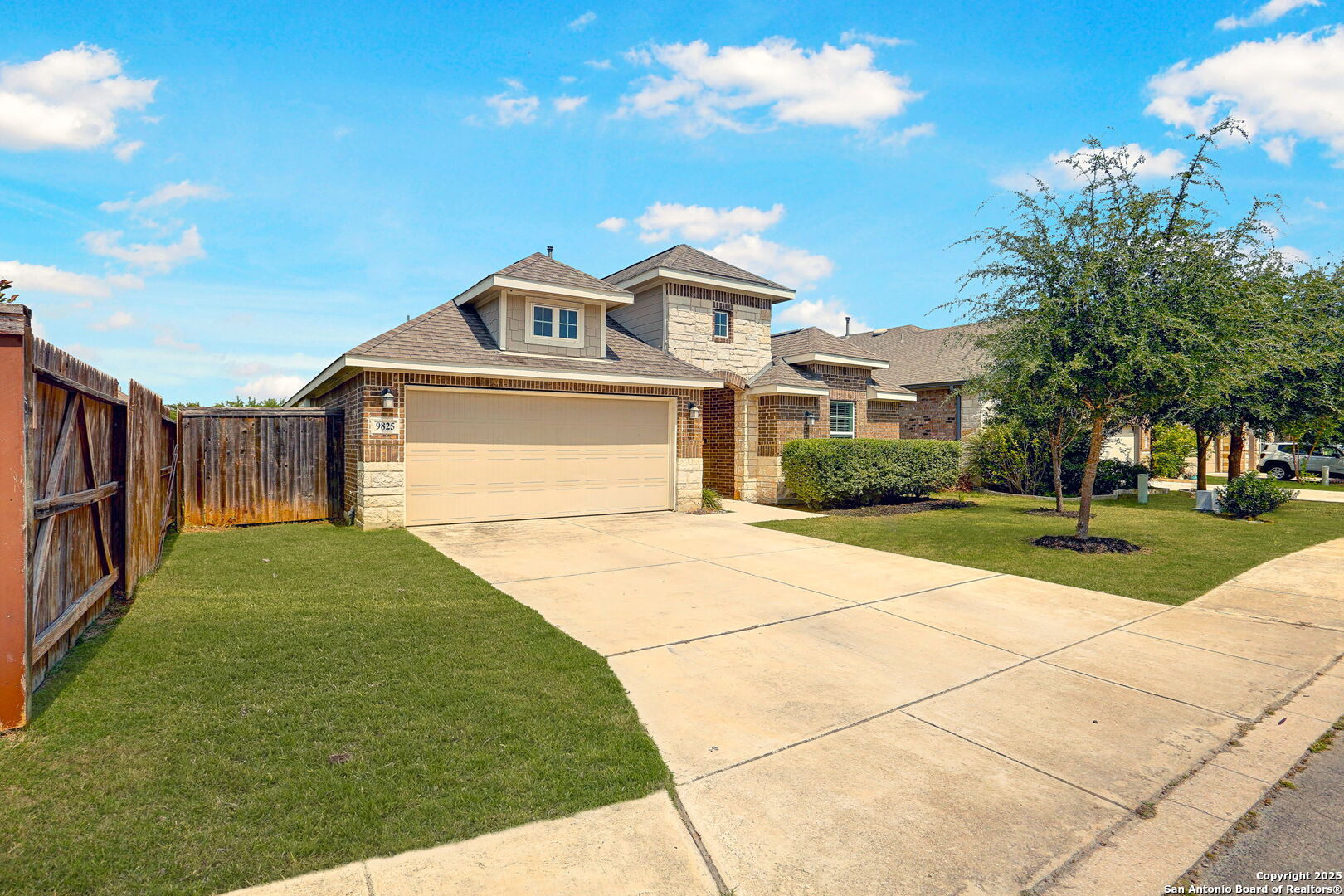 9825 Jon Boat Way Boerne, TX 78006 - Photo 2 of 24 a front view of a house with a yard