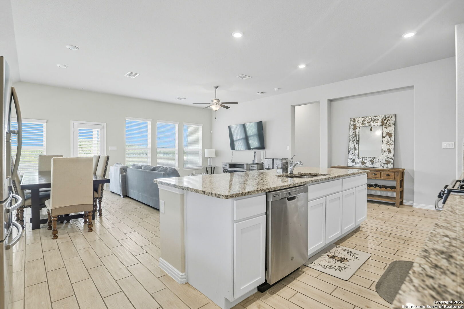 9825 Jon Boat Way Boerne, TX 78006 - Photo 9 of 24 a bathroom with a granite countertop sink and a mirror