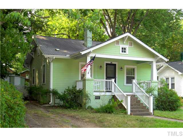 124 Hudson Street Raleigh, NC 27608 - Photo 1 of 19 a view of a house with a yard