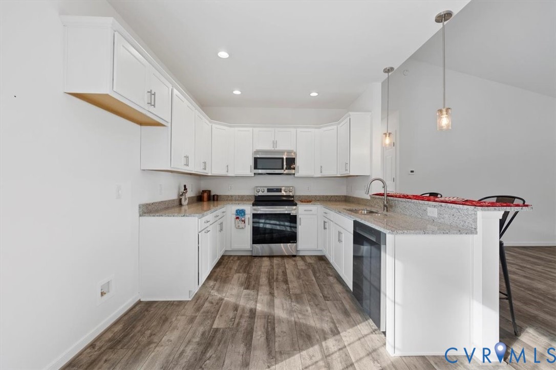 170 Barter Hill Road Cumberland, VA 23040 - Photo 18 of 42 Kitchen featuring a breakfast bar area, light ston