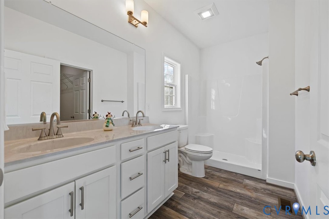 170 Barter Hill Road Cumberland, VA 23040 - Photo 24 of 42 Bathroom with double vanity, a stall shower, LVP f
