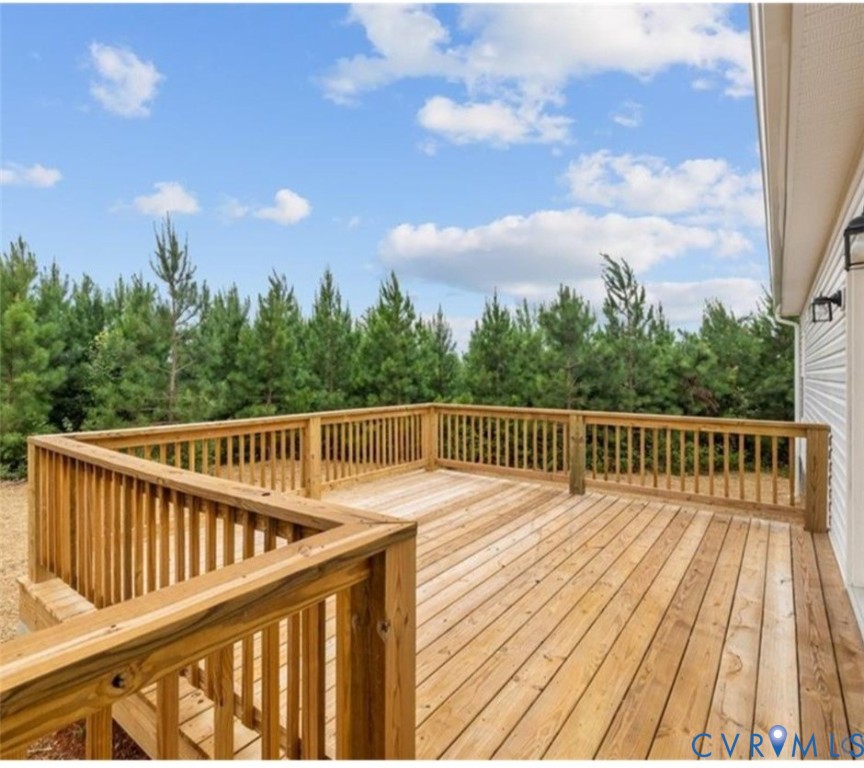 170 Barter Hill Road Cumberland, VA 23040 - Photo 6 of 42 a balcony with wooden floor and fence