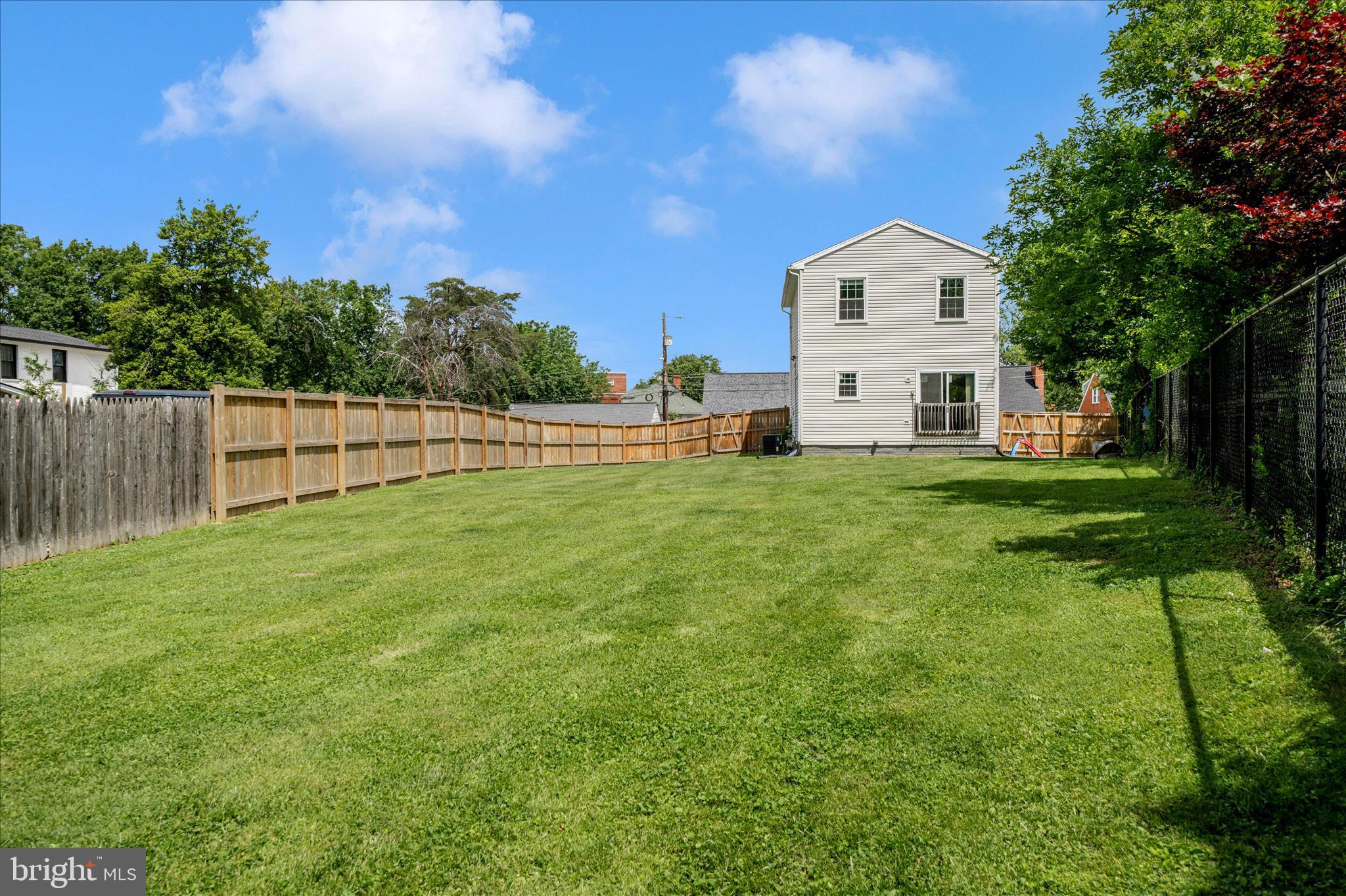 713 Seek Lane Silver Spring, MD 20912 - Photo 49 of 60 a view of a house with a yard and sitting area